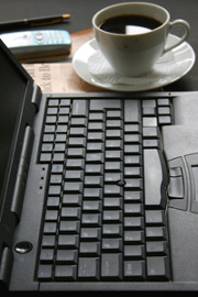 laptop and newspaper and coffee